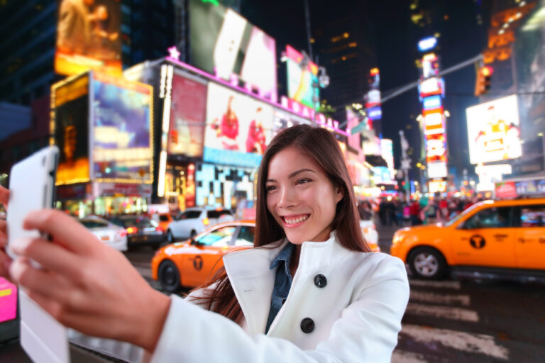 Happy,Woman,Tourist,Taking,Photo,Picture,With,Tablet,In,New