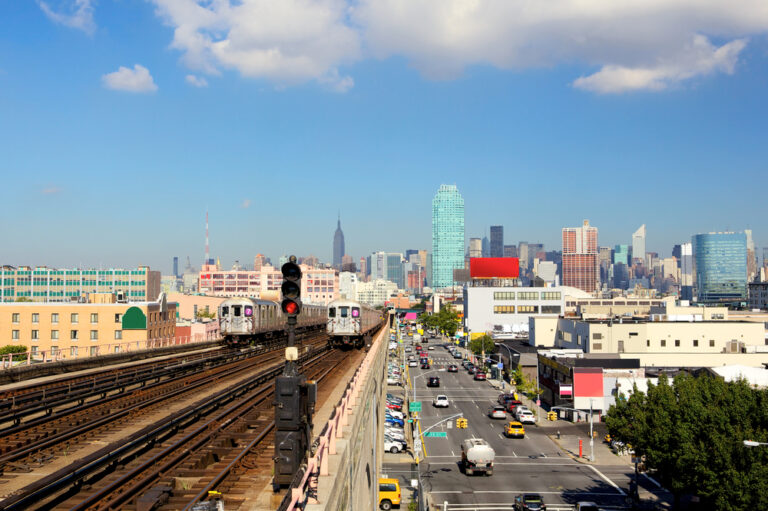 New,York,City,Skyline,From,Subway,Line,In,Queens