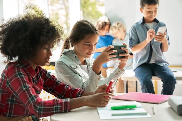 Diverse,Multiethnic,Kids,Students,Using,Smartphones,In,Classroom