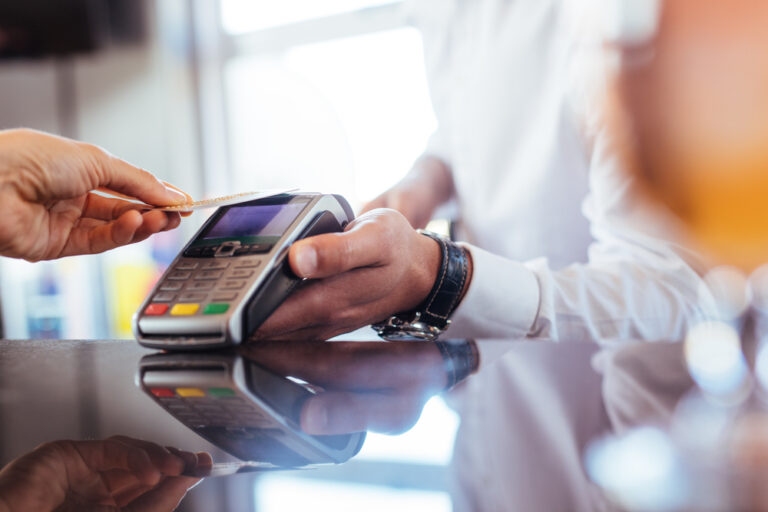 Hand,Of,Customer,Paying,With,Contactless,Credit,Card,With,Nfc