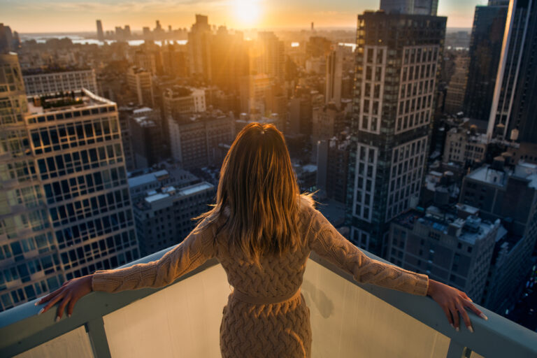 Rich,Woman,Enjoying,The,Sunset,Standing,On,The,Balcony,At