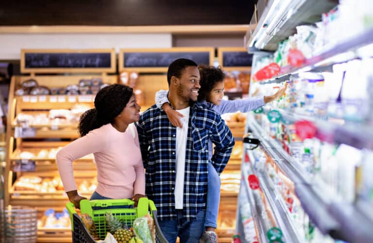 Portrait,Of,Happy,Black,Family,With,Trolley,Shopping,Together,At