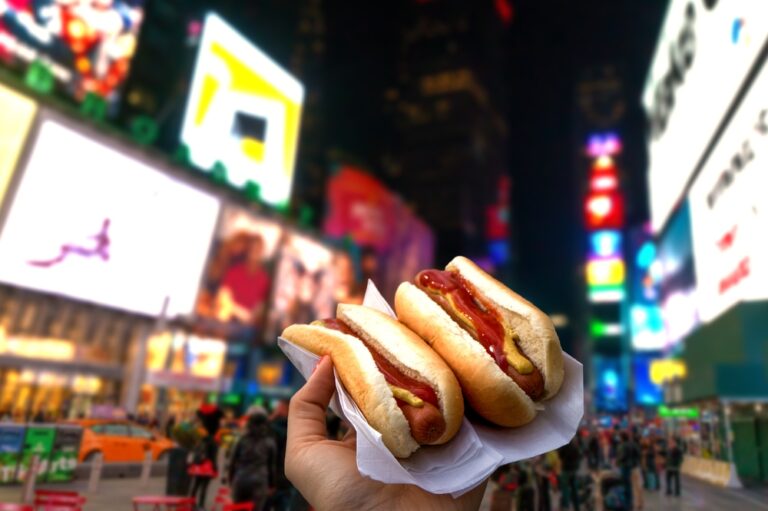 Holding,Two,Hot,Dogs,In,Nyc,On,The,Times,Square