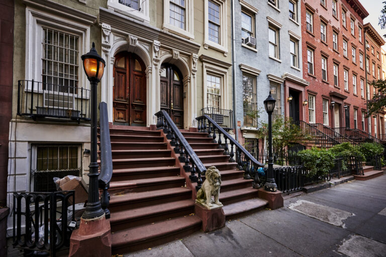 A,Row,Of,Colorful,Brownstone,Buildings,With,A,Warm,Gas