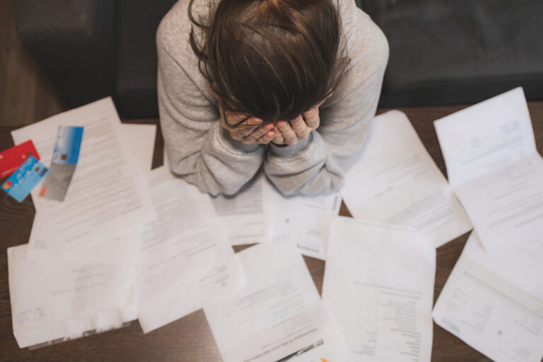 Shocked,Stressed,Young,Woman,Reading,Document,Letter,From,Bank,About