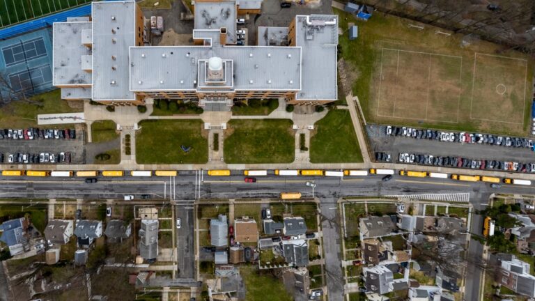 Panoramic,Shot,High,Over,A,Long,Line,Of,Yellow,School