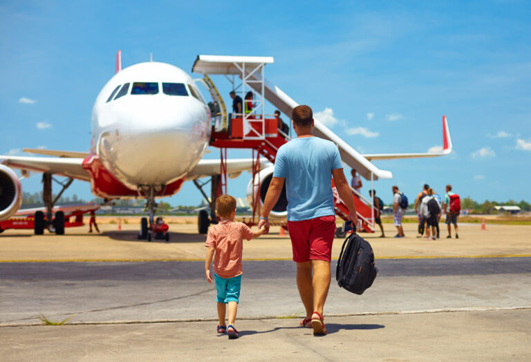 Family,Walking,For,Boarding,On,Plane,In,Airport,,Summer,Vacation