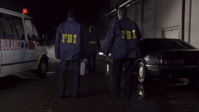 Fbi,Agents,Work,At,The,Scene,At,Night,,Police,Car