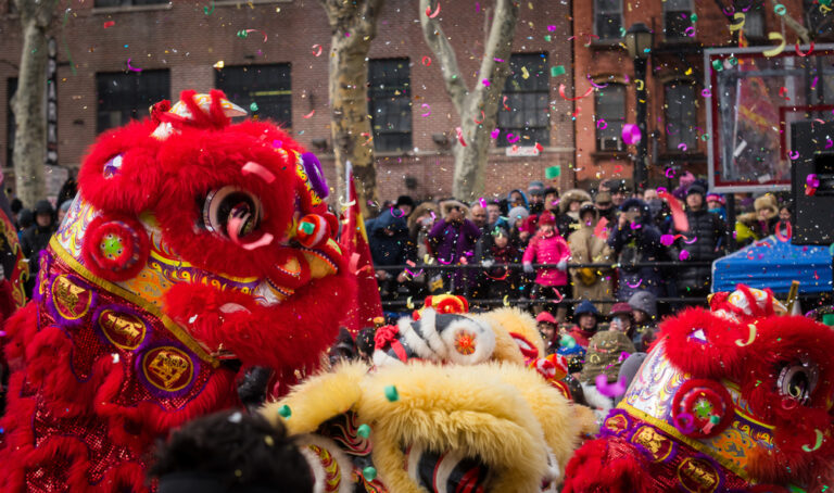 Lion,Dance,And,Confetti,In,A,Crowded,Celebration,Of,Chinese