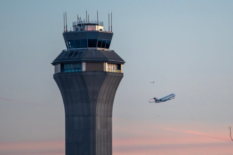 Airport,Control,Tower,During,Takeoff,Airplane