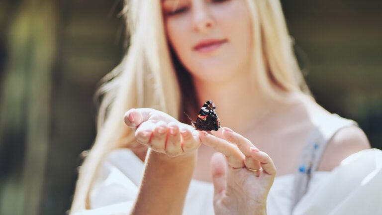 Young,Blonde,Girl,With,A,Butterfly,On,A,Summer,Afternoon