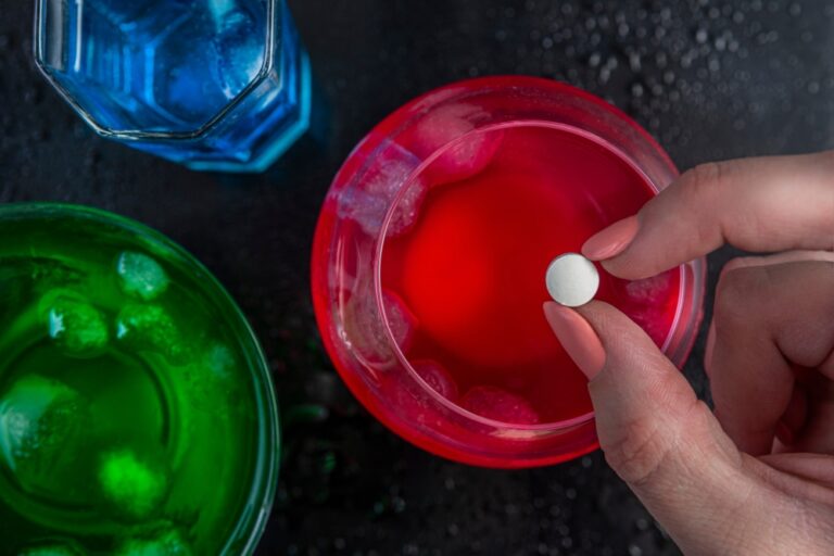 Pouring,Ghb,Into,A,Colorful,Drink,Glass