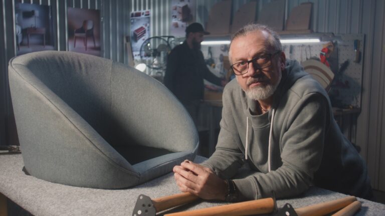 Professional,Male,Carpenter,Stands,Near,Chair,And,Looks,At,Camera